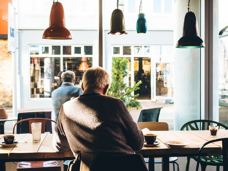 old man in cafe reading old man in cafe reading