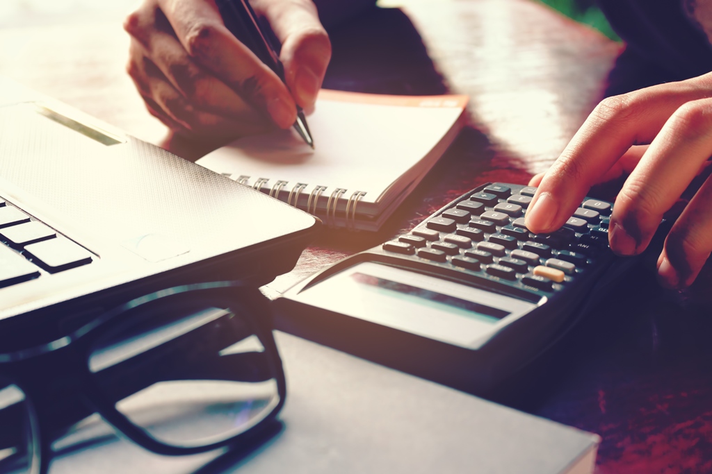 woman using calculator